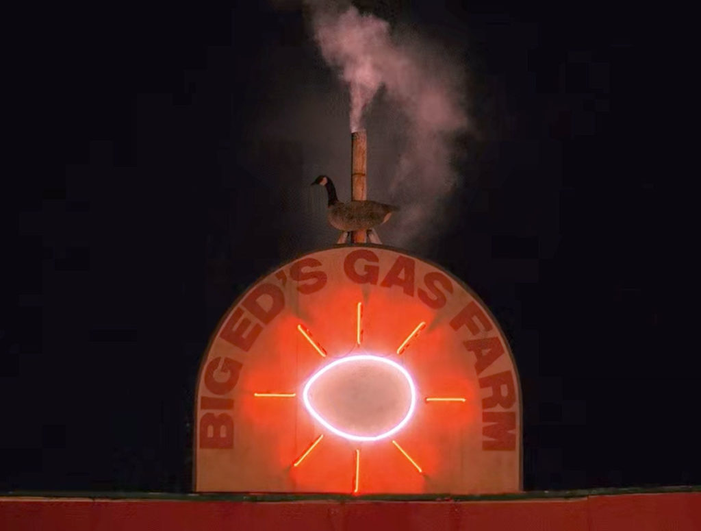 Big Ed's Gas Farm Sign at night