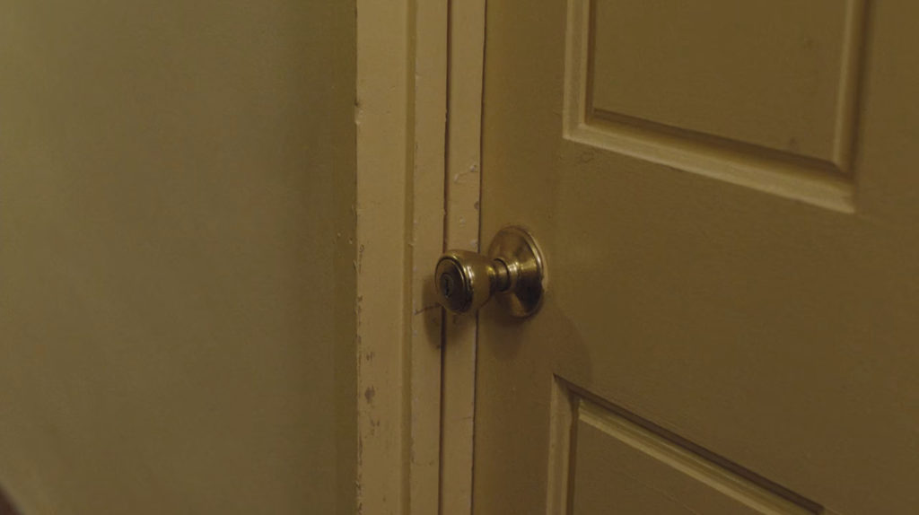 Doorknob for Room 216 in Ruth Davenport's apartment building.