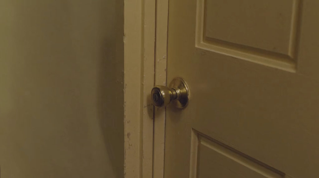 Room 216 doorknob in Ruth Davenport's apartment building.