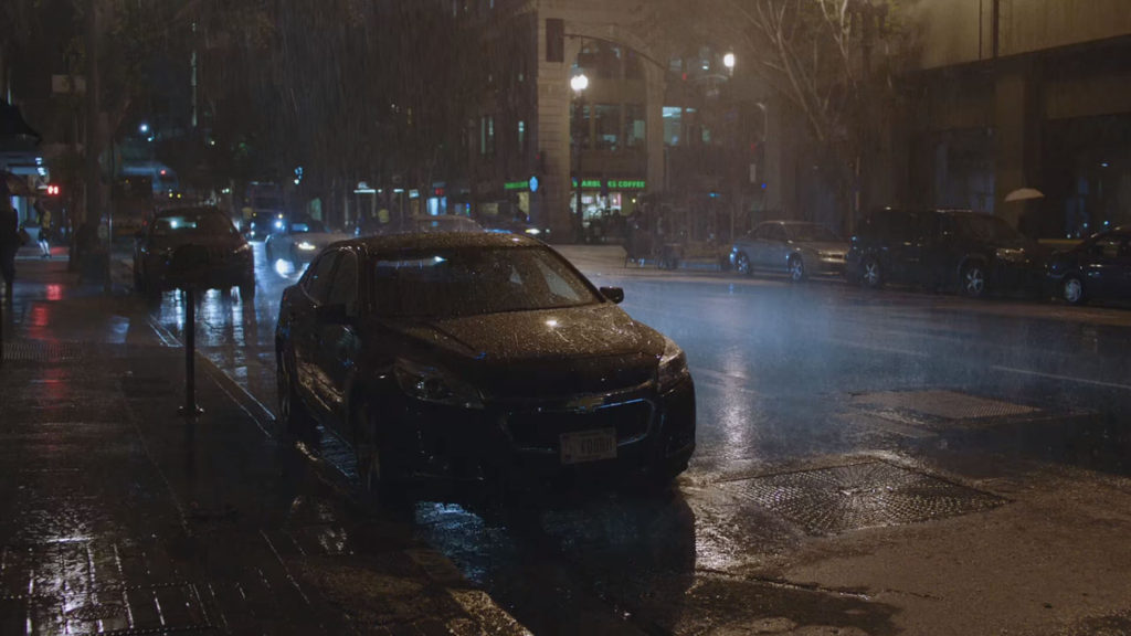 Albert parked his car in the pouring rain.