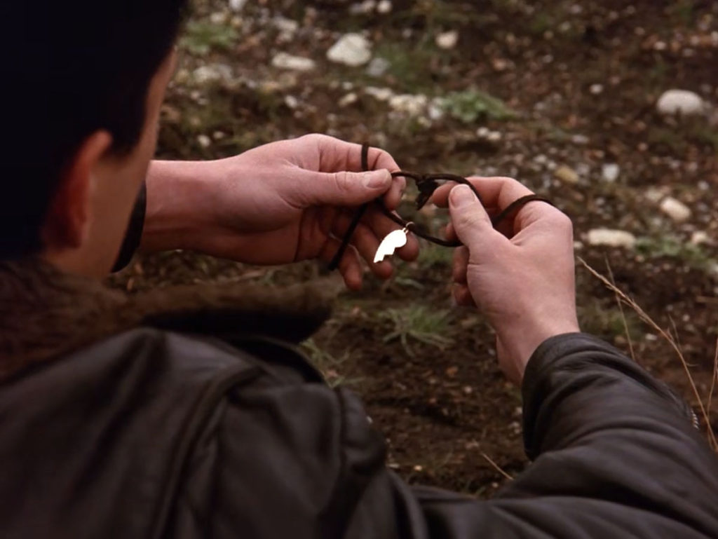 James Hurley holding Laura Palmer's necklace