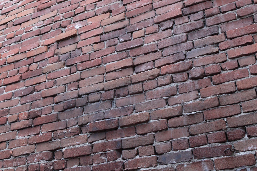 Brick wall from Grand Avenue on May 22, 2019