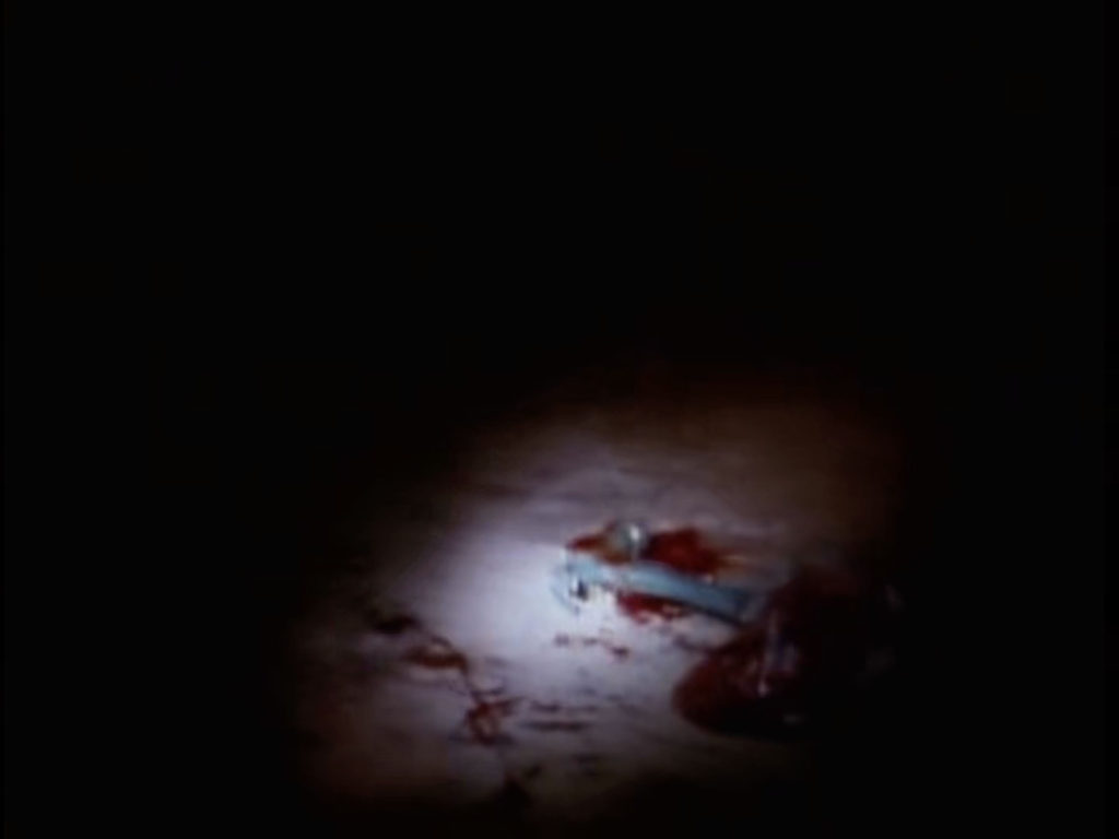 Bloody Hammer on Train Car Floor from Episode 2001