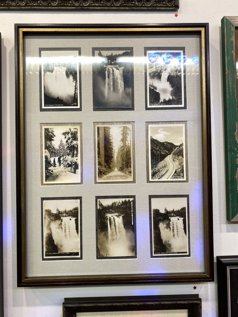 Snoqualmie Falls postcards under antique glass