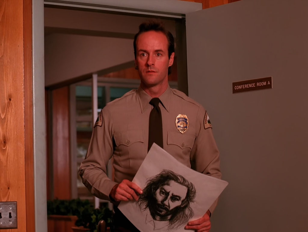 Deputy Andy holding Bob's Sketch