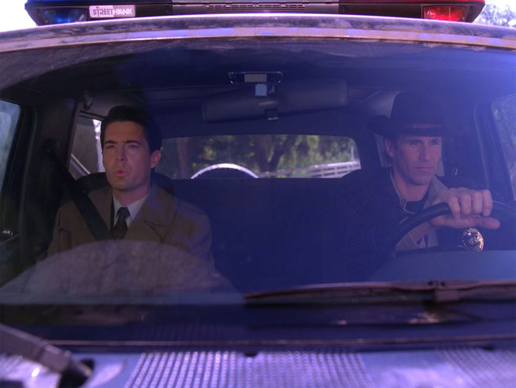 Agent Cooper and Sheriff Truman in the Ford Bronco 