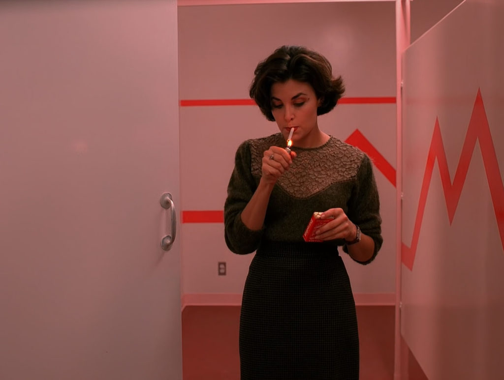 Audrey Horne smoking in the girls room at Twin Peaks High School