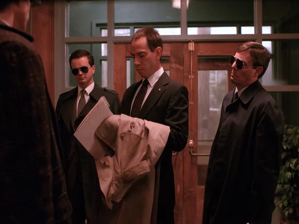 Agent Albert Rosenfield and his team arrive