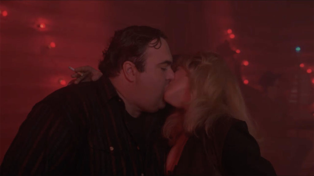 Jaques Renault and Laura Palmer share a kiss