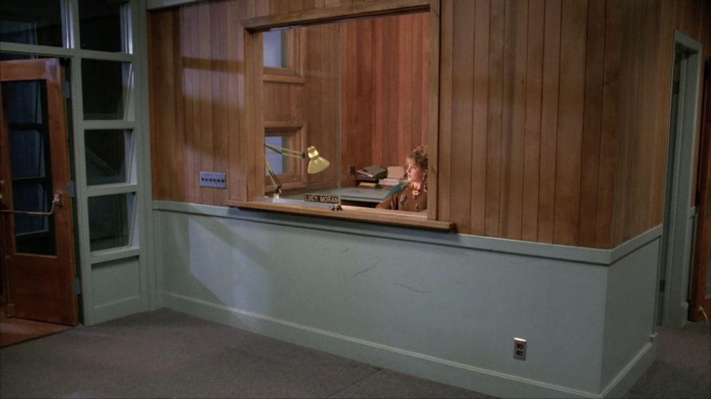 Lucy Moran at the front desk of the Twin Peaks Sheriff's Department