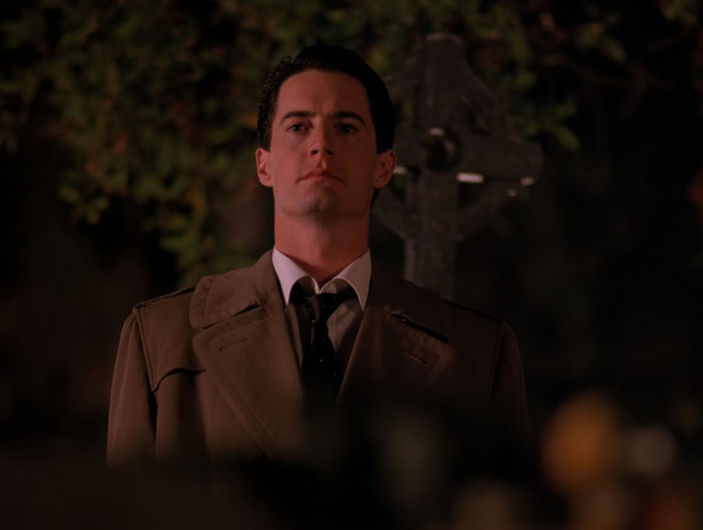 Cooper standing in the graveyard 