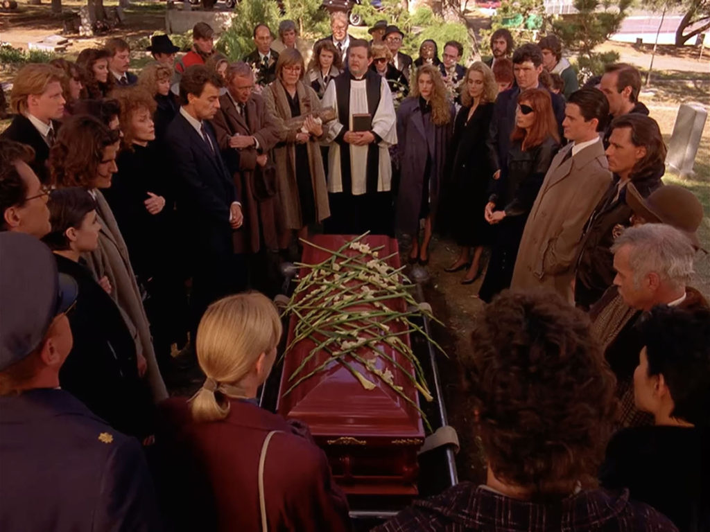 Mourners gathered for a funeral in Episode 1003